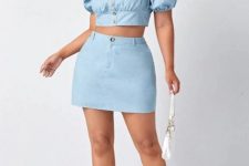 With light blue denim mini skirt, white bag and white lace up sandals