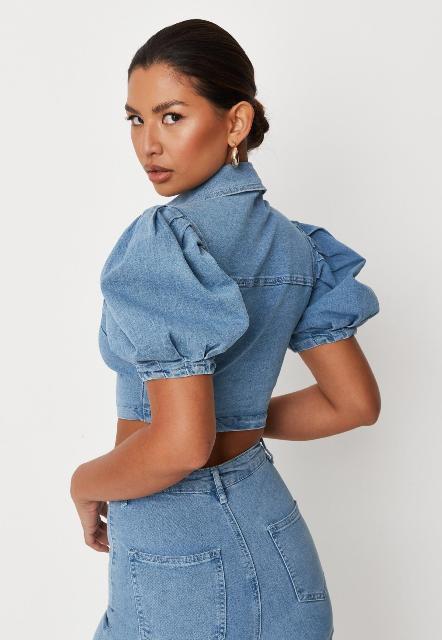 With light blue high waisted jeans