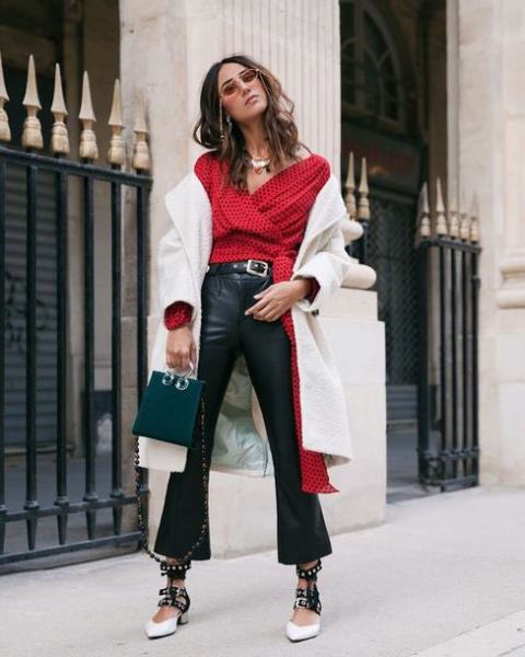 With red polka dot wrap blouse, white coat, emerald bag and black and white embellished shoes