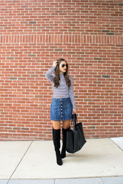 With striped turtleneck, black leather tote bag and over the knee boots
