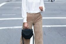 With white blouse, black leather bag and printed pumps