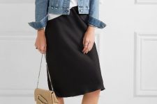 With white loose shirt, black knee-length skirt, beige chain strap bag and white flat shoes