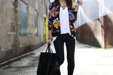 With white loose shirt, skinny pants, black leather tote bag and low heeled shoes