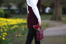 With white shirt, marsala bag and over the knee boots