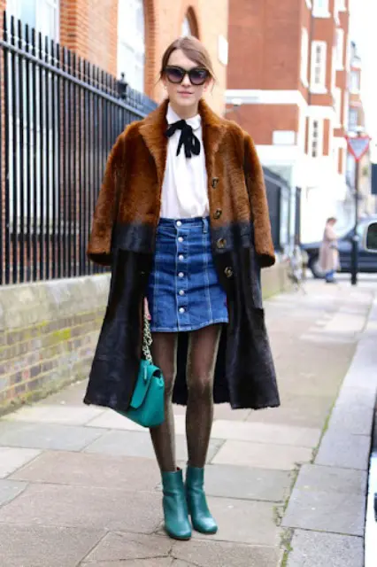 With white shirt, two colored faux fur coat, chain strap bag and leather boots