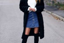 With white sweater, black midi coat and black over the knee boots