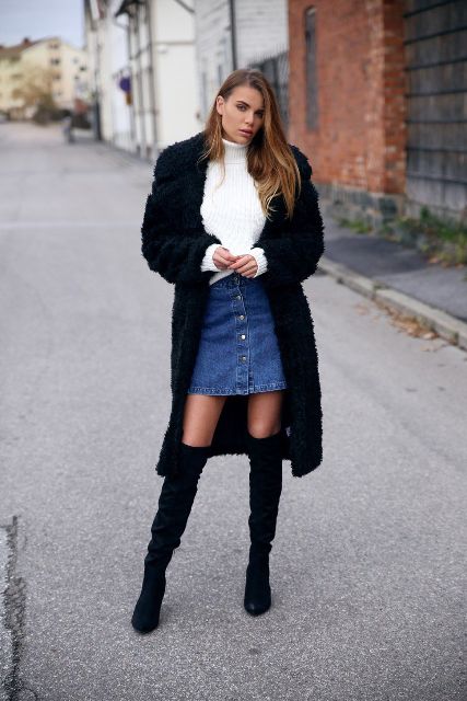 With white sweater, black midi coat and black over the knee boots