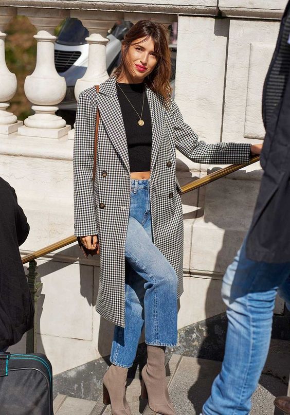 a black crop top, blue cropped jeans, grey sock boots, a gingham coat and a brown bag plus a bold lip