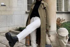 a fall look with a black turtleneck, white jeans, black boots, a green trench and a black bag for the fall