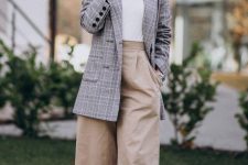 a fall work look with a white t-shirt, an oversized grey blazer, neutral culottes and creamy booties plus statement earrings