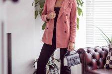 a girlish look with a black top, black flare pants, black heels, a pink corduroy blazer and a silver bag is chic