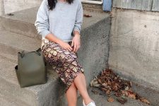 a stylish look with a sweatshirt and a skirt