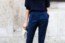 a navy short sleeve jumper, bold blue trousers, matching heels and a creamy bag for an impressive look