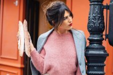 a pink sweater, a grey coat, a creamy slip skirt, an amber bucket bag and a red lip for a French chic look