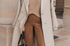 a simple and elegant fall look with a tan jumper, brown suede pants, two tone shoes, a dove grey trench and a black bag