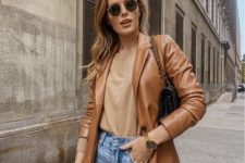 a tan top, blue jeans, an amber leather blazer, a black bag on chain for a simple and fall-inspired outfit