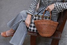 a total gingham look with trousers, an oversized blouse, a plaid bag, brown shoes and a brown bag for a bold statement