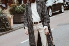 a white jumper, creamy jeans, white sneakers, a plaid coat, a gret beret, a two tone bag