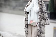 a white oversized sweater, a neutral pleated maxi, a snakeskin print fur coat, snakeskin print booties and a white beret