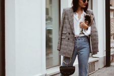 a white shirt, a grey plaid blazer, blue jeans, rust-colored booties and a black bag with a ring handle for work in the fall