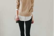 a white shirt, a tan jumper, black leggings, tan Oxford shoes and a grey bag for a stylish and super comfy work look