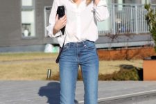 a white shirt, blue cropped flare jeans, leopard print shoes and a black bag for a simple yet bold look