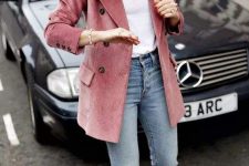 a white t-shirt, blue jeans, black heels, a pink corduroy oversized blazer, a chain necklace for a cute and girlish outfit