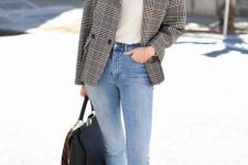 a white turtleneck, a grey plaid blazer, blue cropped jeans, rust-colored shoes and a large comfy bag