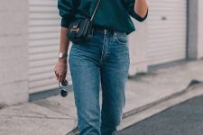 an emerald sweatshirt, blue slim leg jeans, yellow shoes and a black bag on chain for a simple look