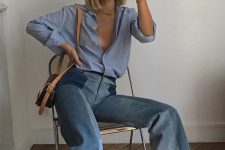 blue flare jeans, a blue shirt, a brown crossbody bag and blue strap shoes for a stylish look