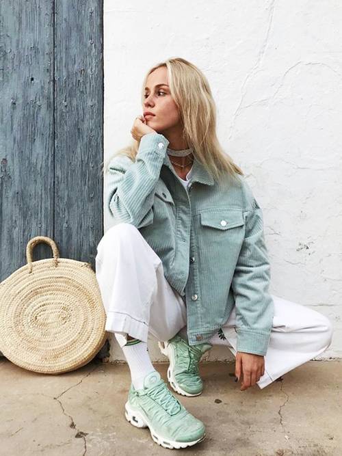 white jeans, mint green trainers, a mint blue corduroy blazer and a round bag for a summer to fall outfit