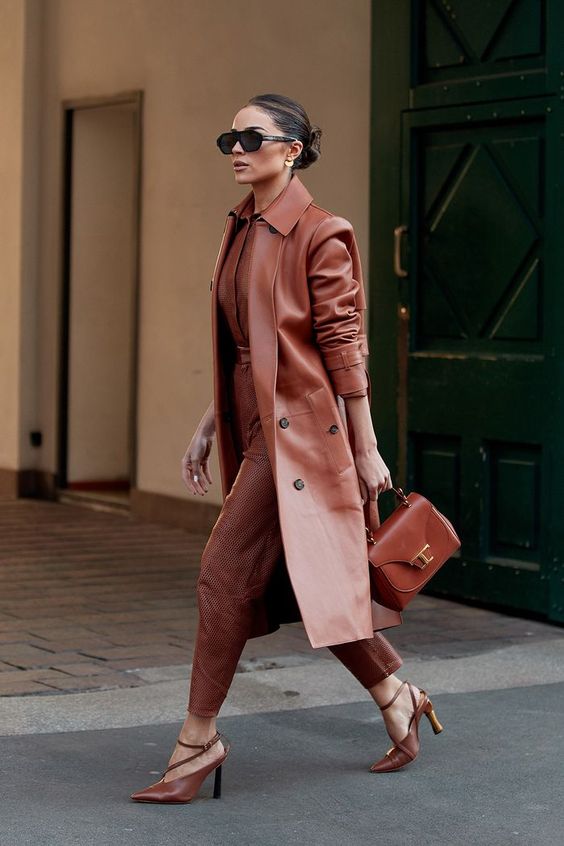 a fantastic caramel chocolate look with a shirt, leather pants, strappy shoes, a leather coat and a bag