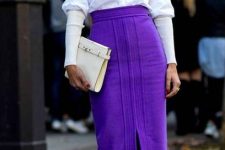05 a catchy and bold fall outfit with a white turtleneck and a white, a violet midi skirt, yellow boots and a white clutch