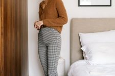 06 a French chic fall work look with a rust-colored cardigan as a shirt, plaid flare trousers, rust-colored shoes