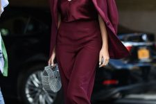 07 a chic party look with a burgundy top and pantsuit, silver boots and a silver bag is a bold idea to go for