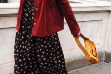 08 a bright fall outfit with a black floral maxi dress, a red leather jacket, white sneakers, a bright yellow mini bag