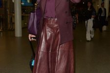 10 a deep purple t-shirt and a matching blazer, a burgundy leather A-line skirt, white sneakers and a purple bag