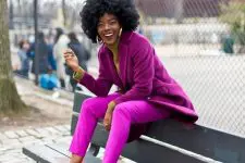 10 a stylish fall look with a tan turtleneck, fuchsia pants, a purple oversized blazer, white and pink trainers