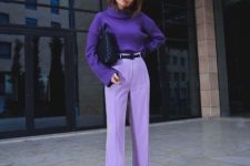 11 a simple and stylish fall outfit with a deep purple sweater, lavender trousers, a black belt and a black bag