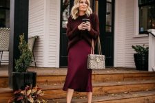 12 a girlish and cozy monochromatic burgundy look with a sweater, a slip midi skirt, heels and a snakeskin printed bag