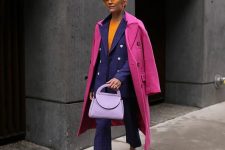 13 a colorful work look with an orange top, a violet printed pantsuit, a pink coat, pink shoes and a lilac bag