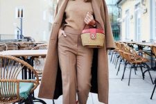 15 a total tan outfit with a jumper, trousers, a midi coat, burgundy suede shoes and a lovely basket bag