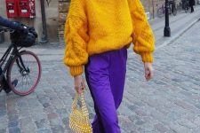 20 a colorful fall outfit with an oversized chunky marigold sweater, purple trousers, emerald heels and an embellished bag