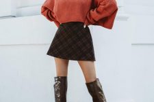 21 a rust oversized cropped sweater, a brown plaid A-line mini skirt, brown over the knee boots for a sexy look