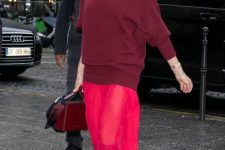 25 a super catchy outfit with an oversized burgundy sweater, a hot pink semi sheer skirt, burgundy boots and a bag