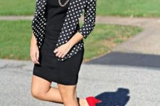 With black mini dress, golden necklace and red suede low heeled shoes