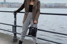 With black top, blazer, gray high-waisted trousers and bag