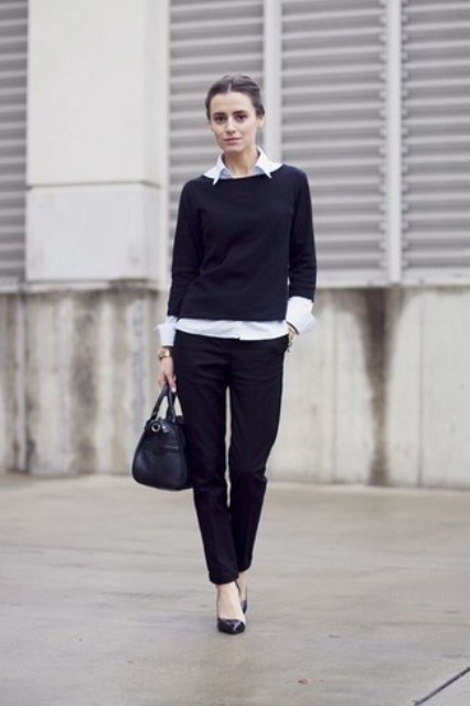 With classic black trousers, black leather bag and black pumps