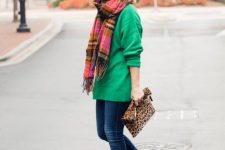 With colorful plaid scarf, green long sweater, jeans and leopard printed clutch