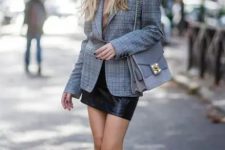 With gray beret, checked blazer, beige turtleneck, black leather mini skirt and chain strap bag